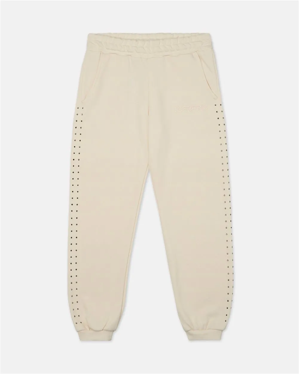 Pantaloni felpati modello joggers color panna con borchie